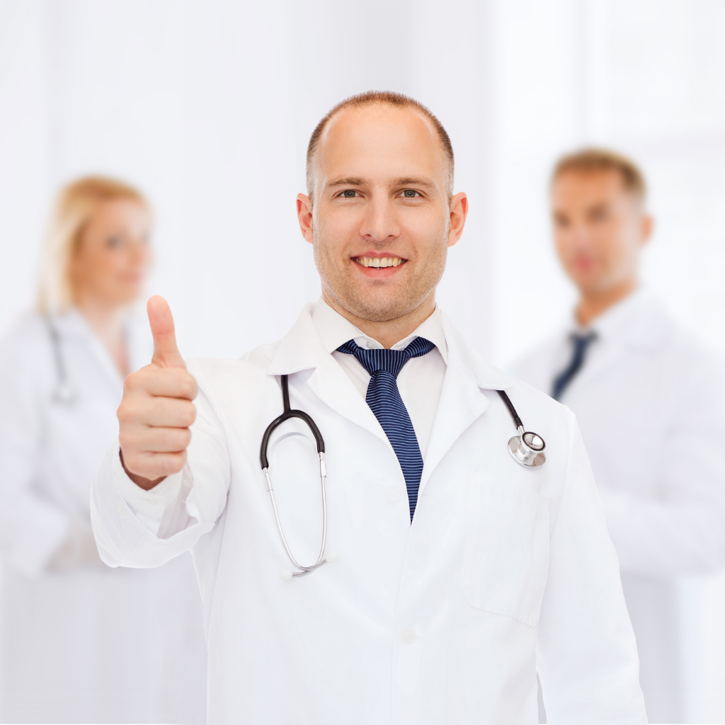 Doctor giving a thumbs-up to represent that TMS has received FDA clearance for the treatment of OCD.