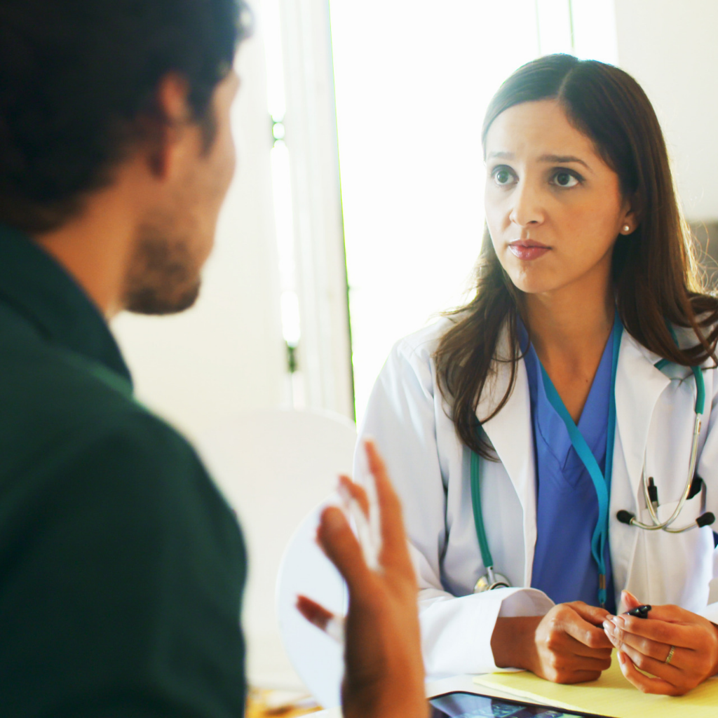 Patient speaking with a healthcare provider about whether TMS may be an appropriate treatment option for OCD.