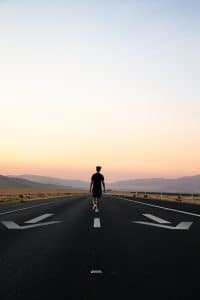 a man walking on the road