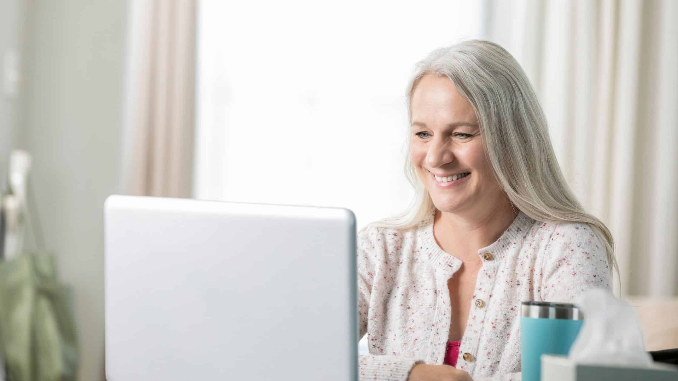 woman looking at her laptop