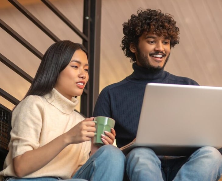 woman with cup man looking laptop 259150 58767 1