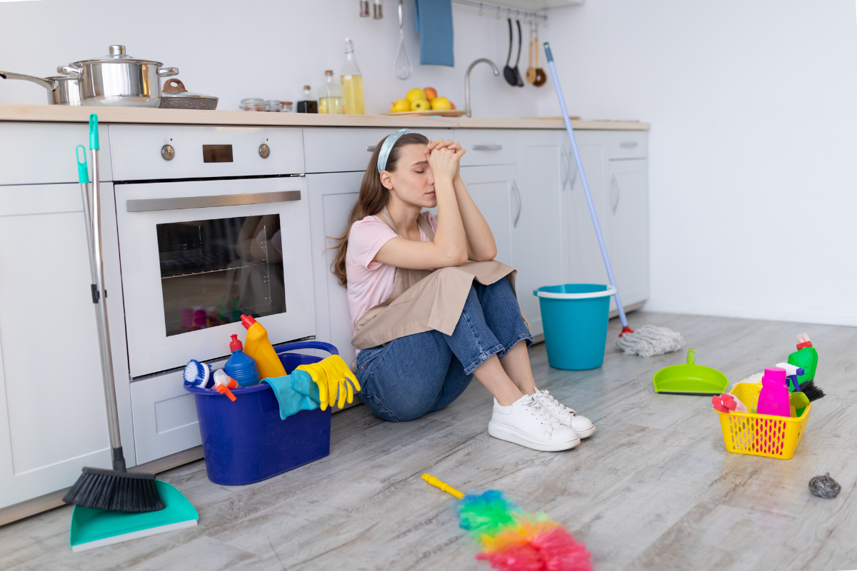 Woman overwhelmed by compulsive cleaning, showing OCD behavior.