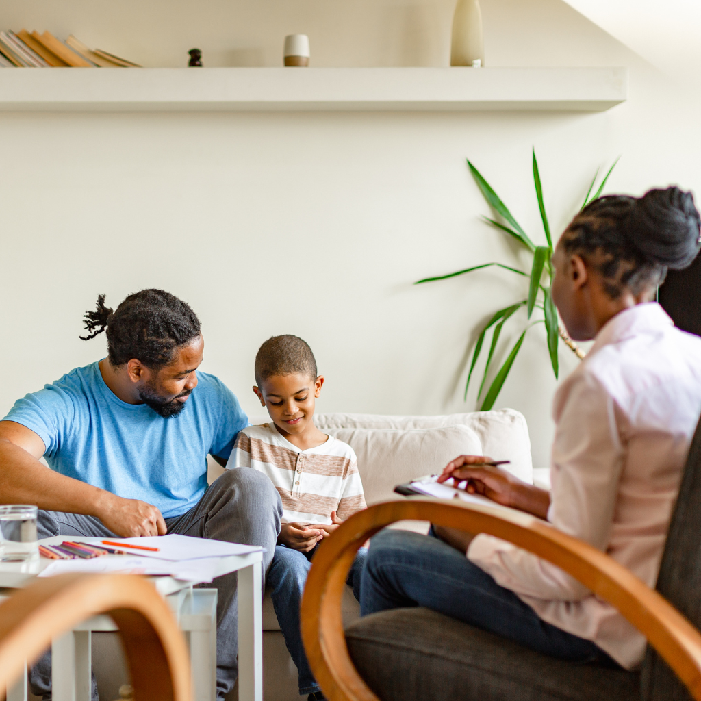 Understanding PTSD in Children and Adolescents: Healing After Trauma 2 Child in therapy session with a parent and mental health professional.