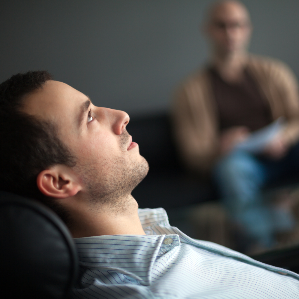 Healing from Within: Exploring the Depths of Trauma Therapy 1 Man in therapy session, showing trauma-focused treatment techniques.