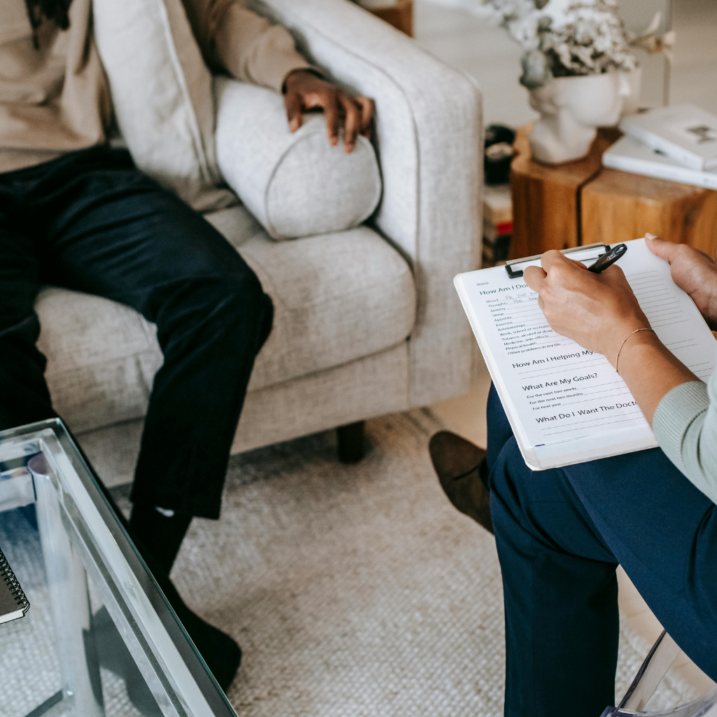 What Are Anxiety Disorders and What Causes Them? 2 Person in a therapy session discussing mental health, representing anxiety as a diagnosable condition.