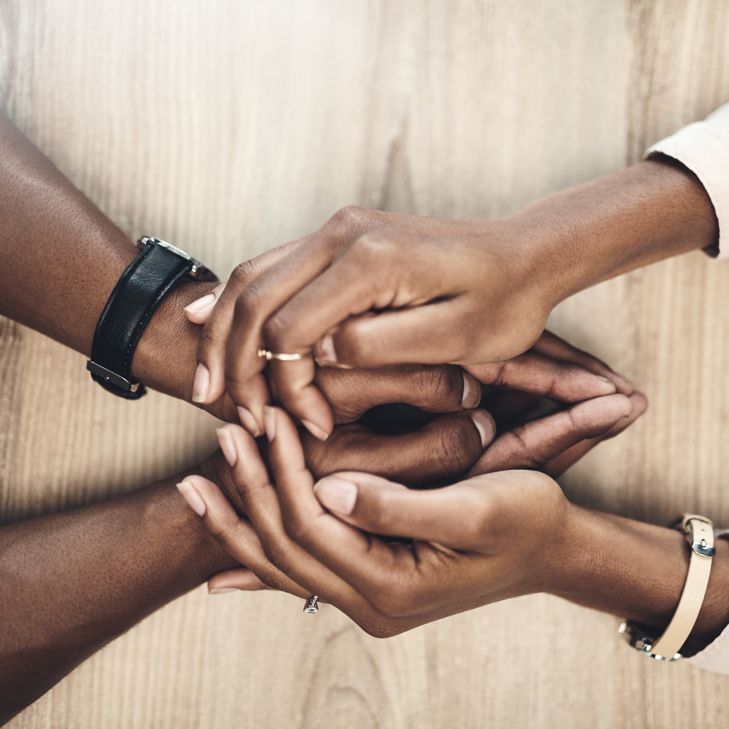 Understanding LGBTQ+ Mental Health Disparities 2 Two people holding hands in a supportive gesture, symbolizing trust and affirmation.