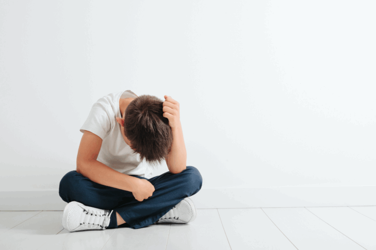 Child showing signs of anxiety and emotional distress.