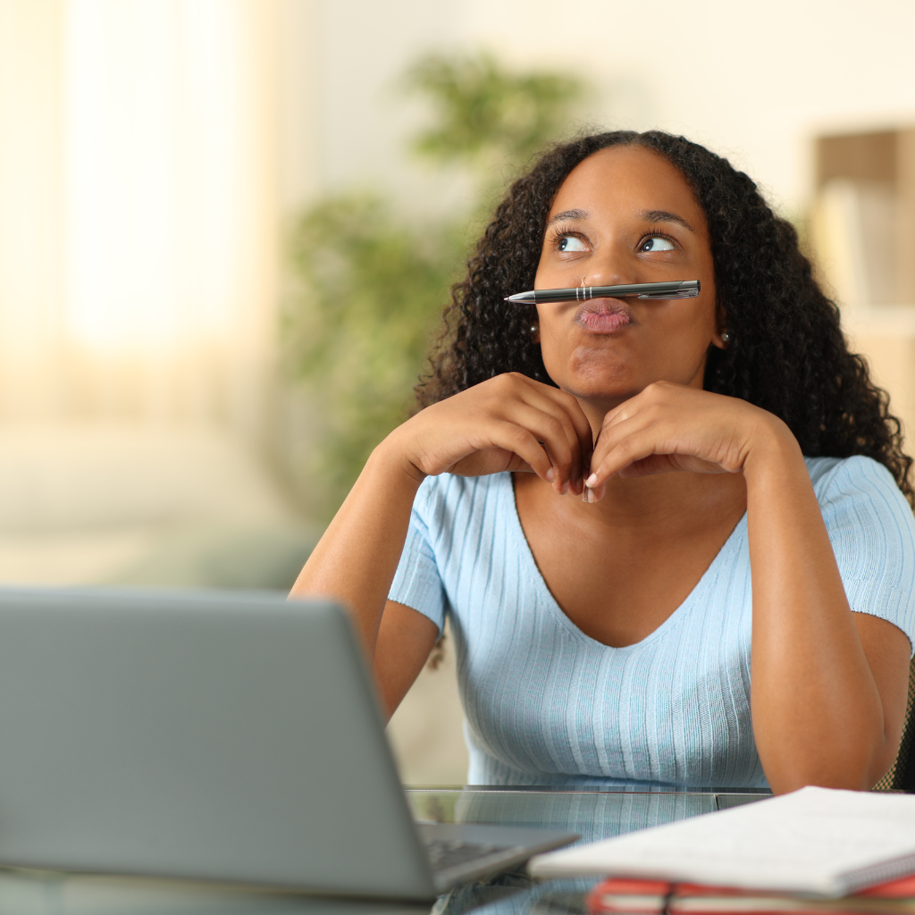 Understanding the Difference Between ADHD and ADD: A Comprehensive Guide 1 Woman appearing distracted while working, illustrating inattentive symptoms of ADHD.