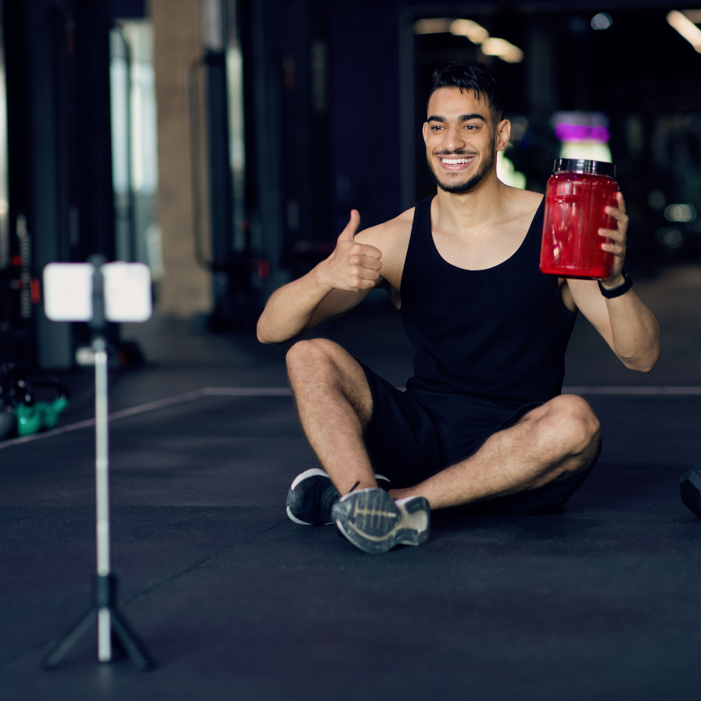 Social Media's Influence on Body Image and Eating Disorders 1 A guy recording his workout for his social media