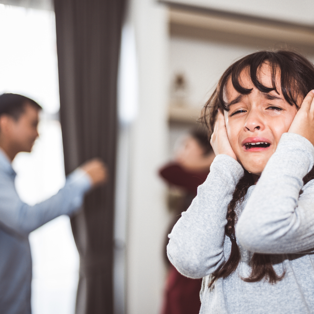 Understanding Borderline Personality Disorder: Symptoms, Causes, and Treatment 1 Crying child covering ears during a conflict, reflecting early emotional trauma linked to BPD risk.