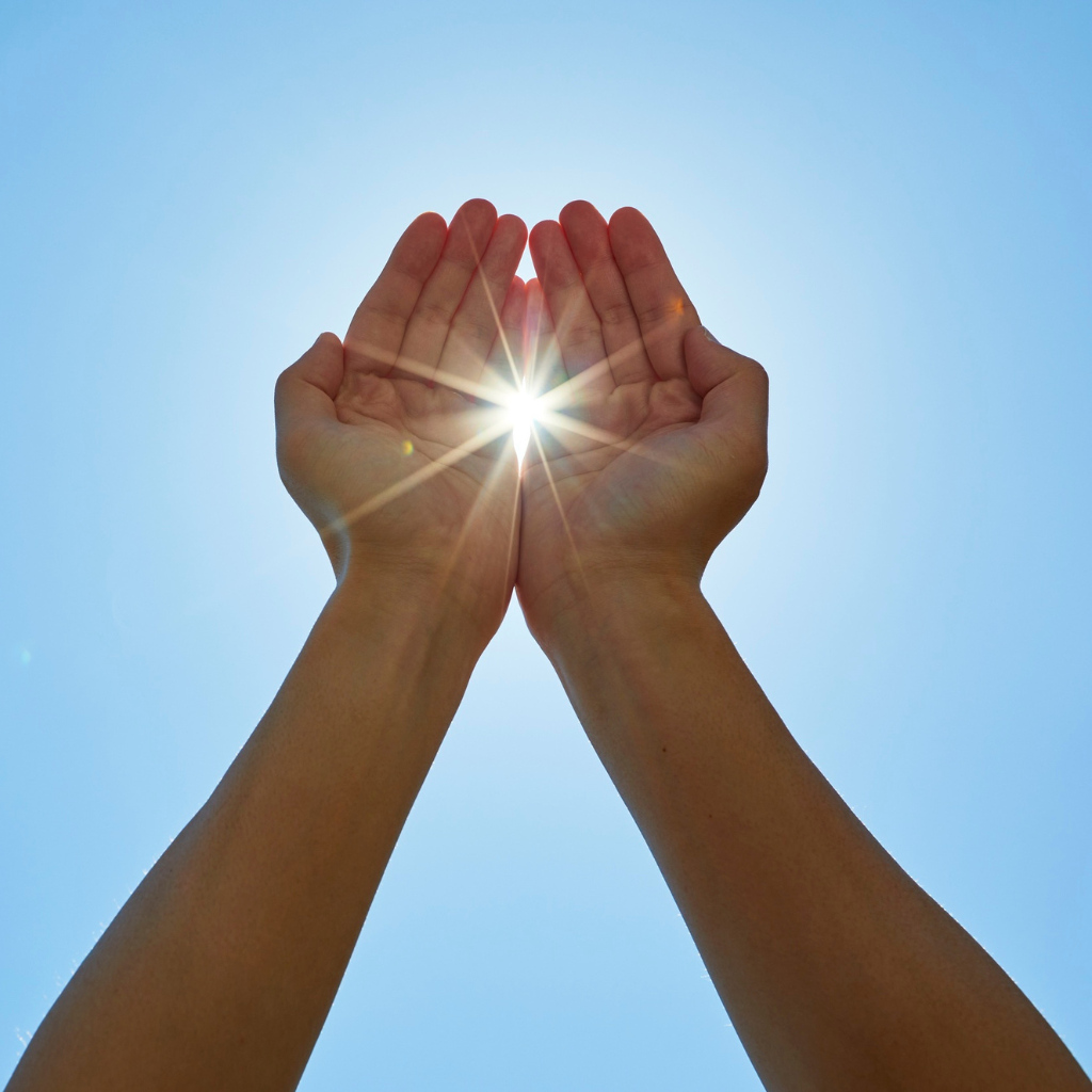 Understanding Narcissistic Personality Disorder: Beyond the Stereotypes 2 Hands reaching toward sunlight, representing hope, growth, and the possibility of change for person with NPD.