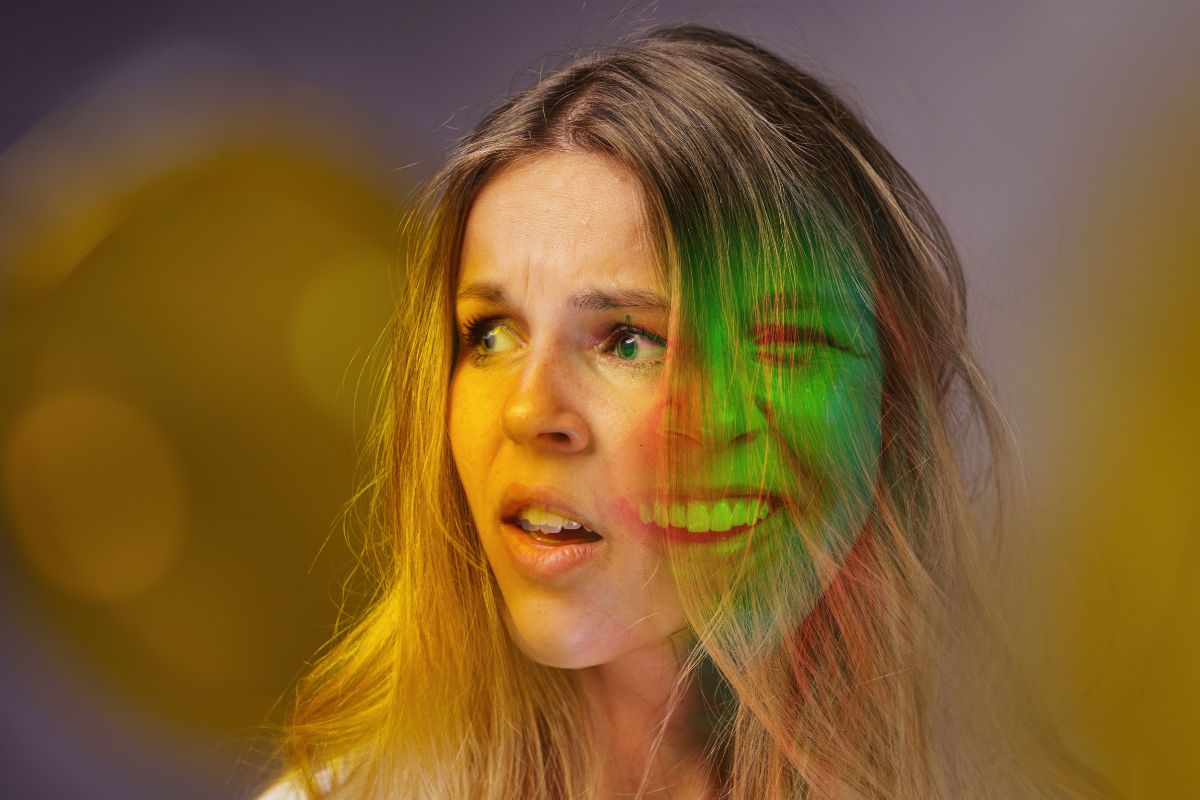 Woman showing mixed emotions, representing the mood shifts in bipolar spectrum.
