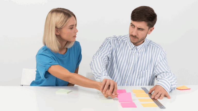 Man reacting as woman disrupts his organized notes, highlighting OCD behavior.
