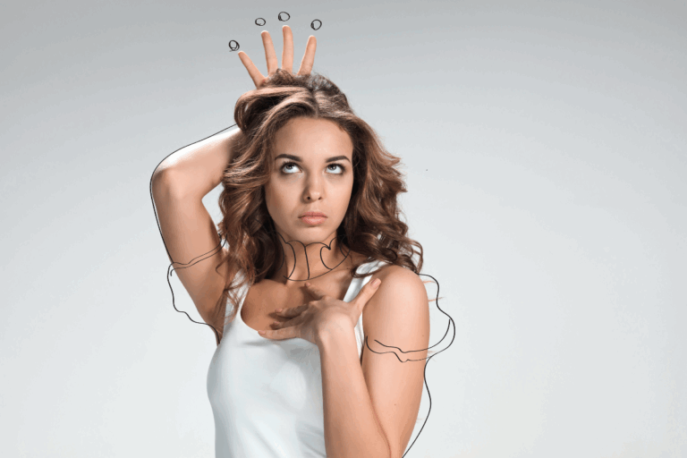Woman striking a confident pose with a playful expression, reflecting common stereotypes about narcissism.