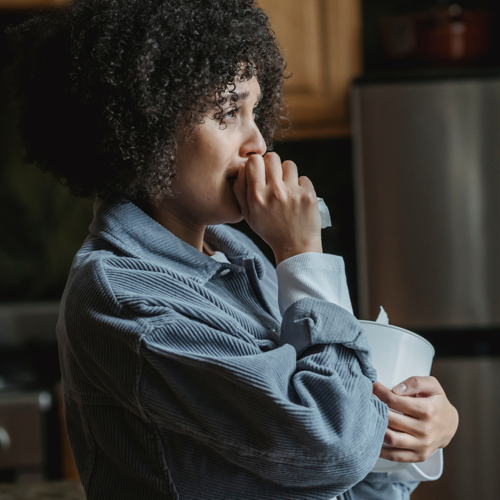 Woman showing visible signs of stress, tense and emotionally overwhelmed