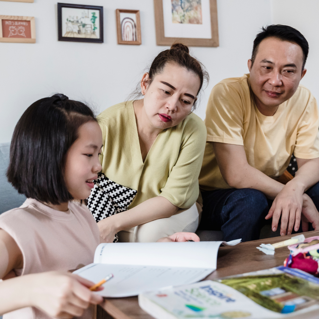 Learning Disabilities: Understanding Challenges and Unlocking Potential 2 Parents helping their child study, showing support for learning disabilities.