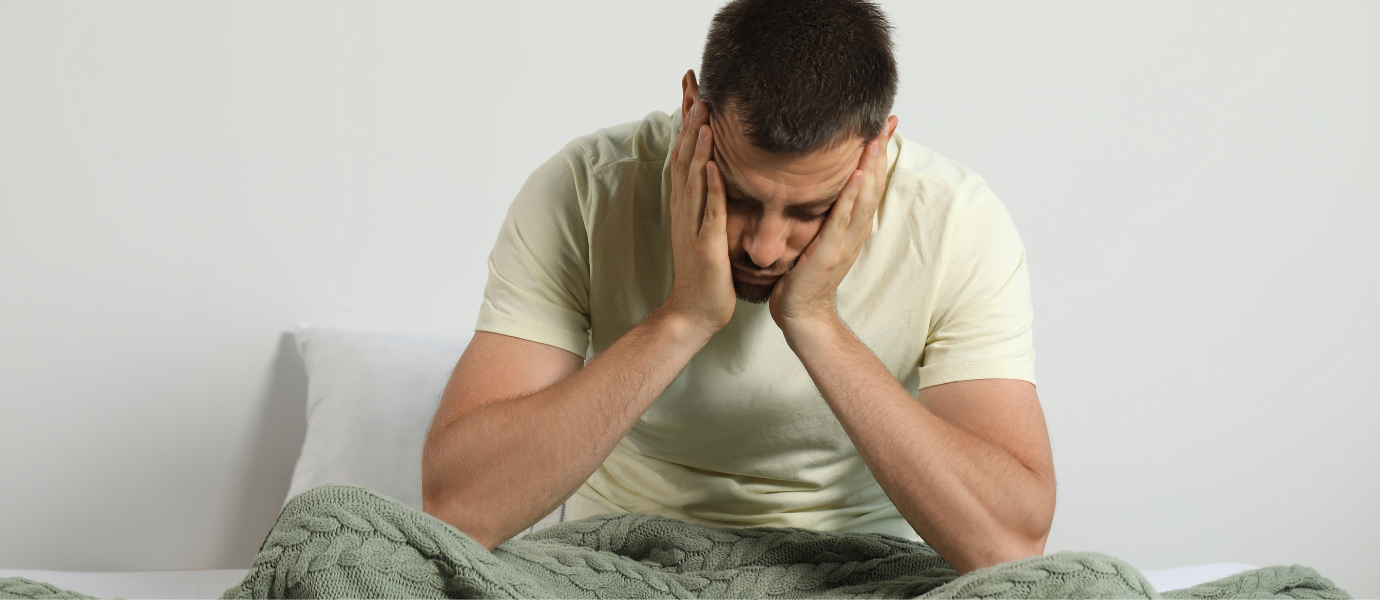 a man sleepy and unhappy