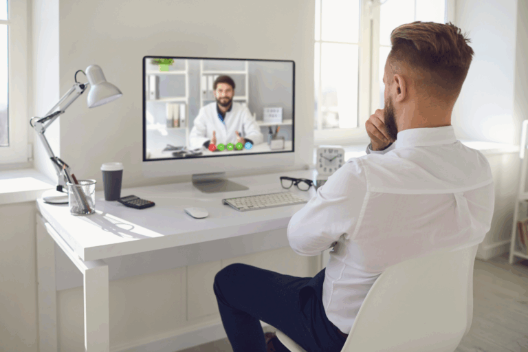 Man attending a telepsychiatry session with a mental health professional via video call.