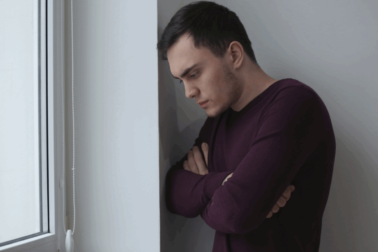 a man feeling blue, suffering the symptoms of Dysthymia