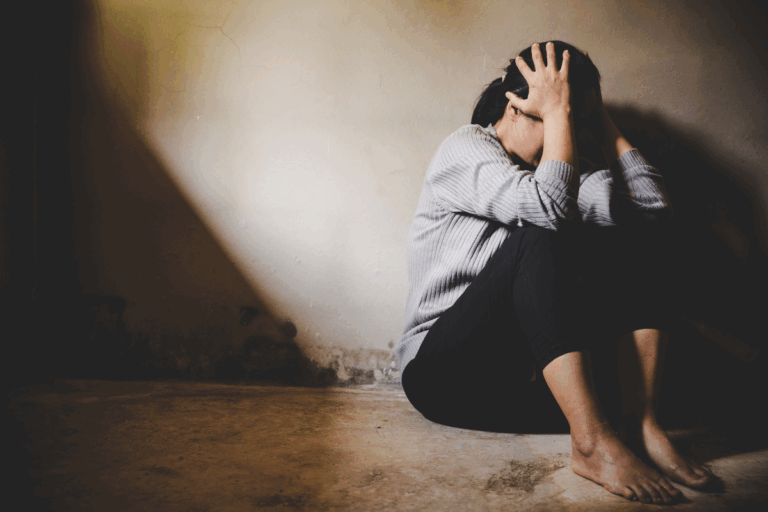 Woman overwhelmed and distressed, representing the impact of double depression symptoms.
