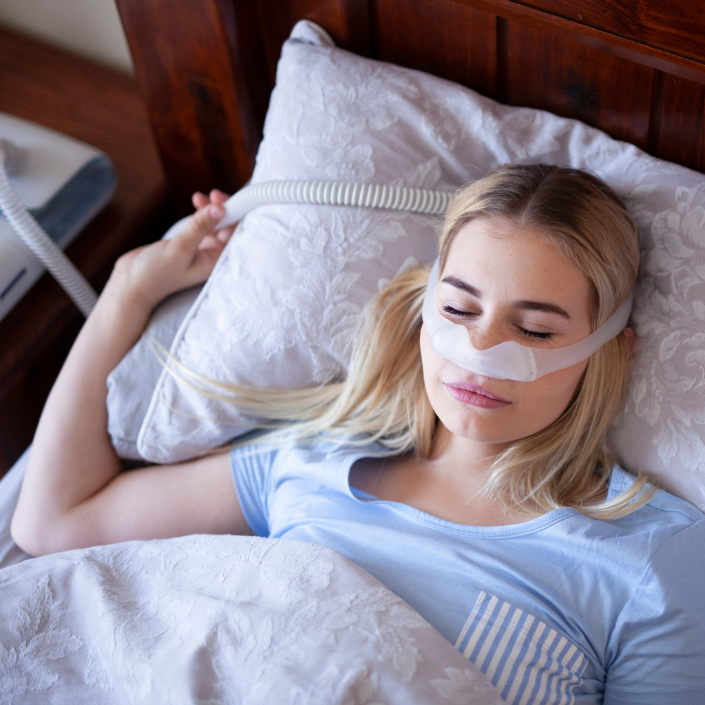 The Vicious Cycle of Depression and Sleep: Breaking the Pattern 2 Woman sleeping with a CPAP mask for sleep apnea