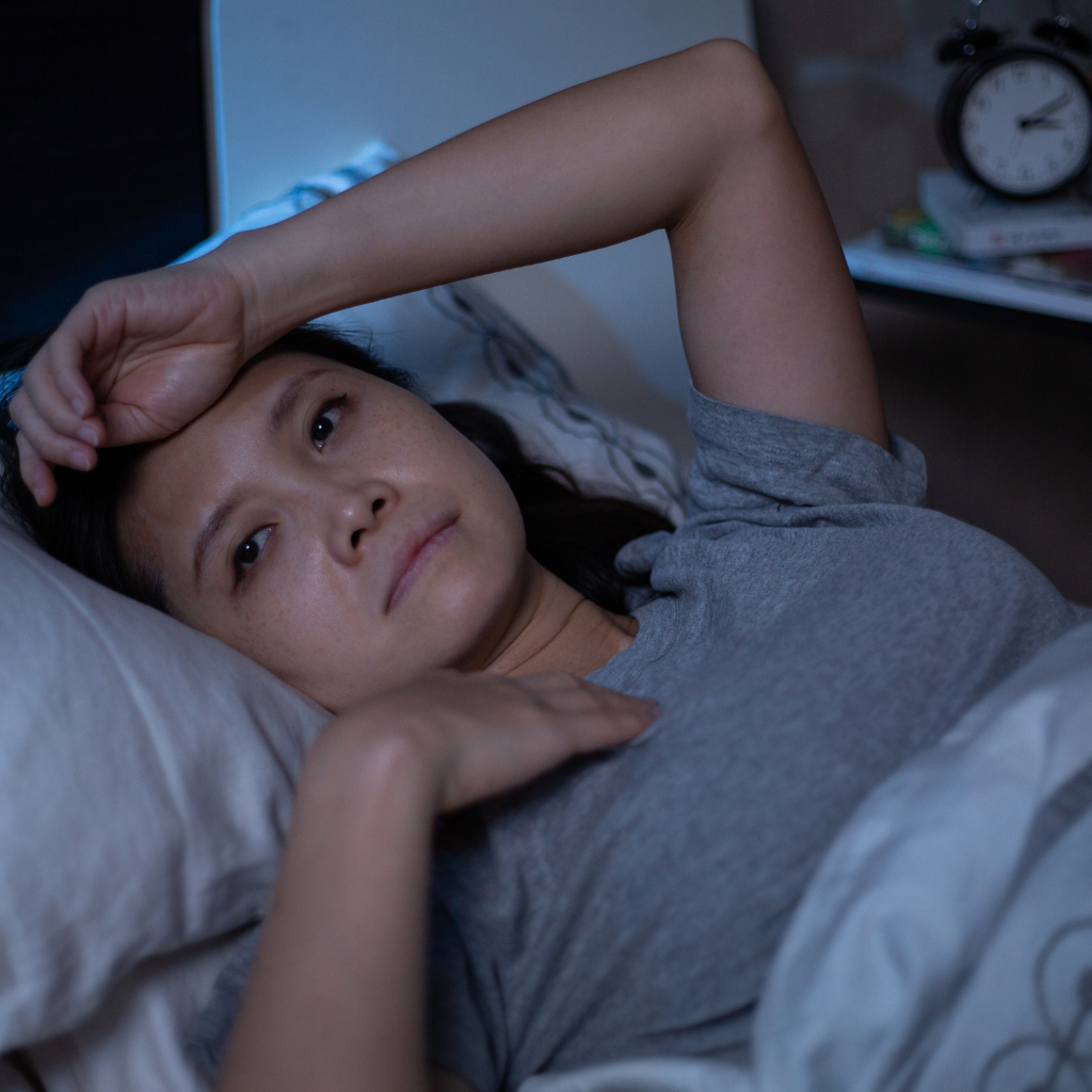woman lying awake in bed with insomnia.