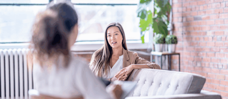 A therapist and client talking during a Solution-Focused Brief Therapy (SFBT) session.