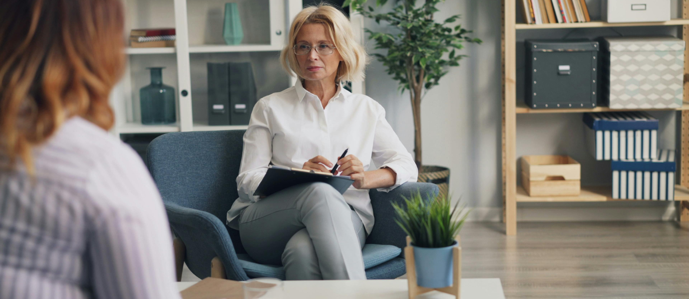 Psychiatrist in New York talking with a patient during depression treatment session.