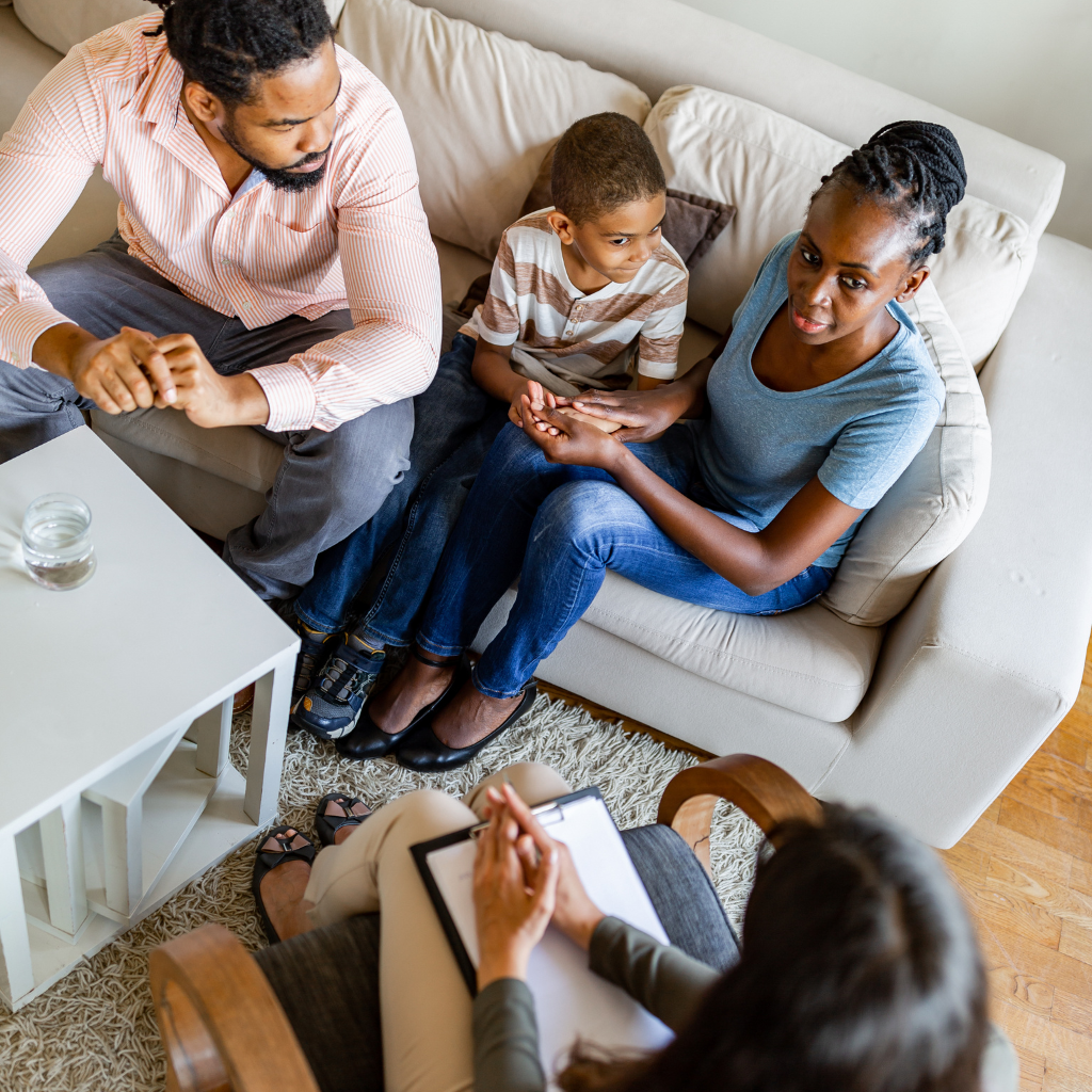 Parental involvement in CBT for children during a therapy session.