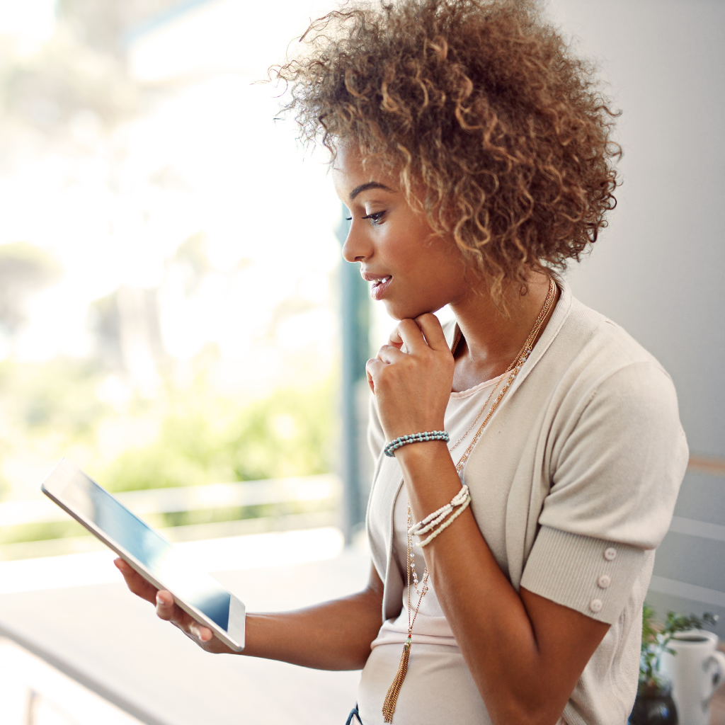 Solution-Focused Brief Therapy (SFBT): Practical Steps Toward Change 2 A woman reading on a tablet, reflecting on therapy approaches like CBT and SFBT.