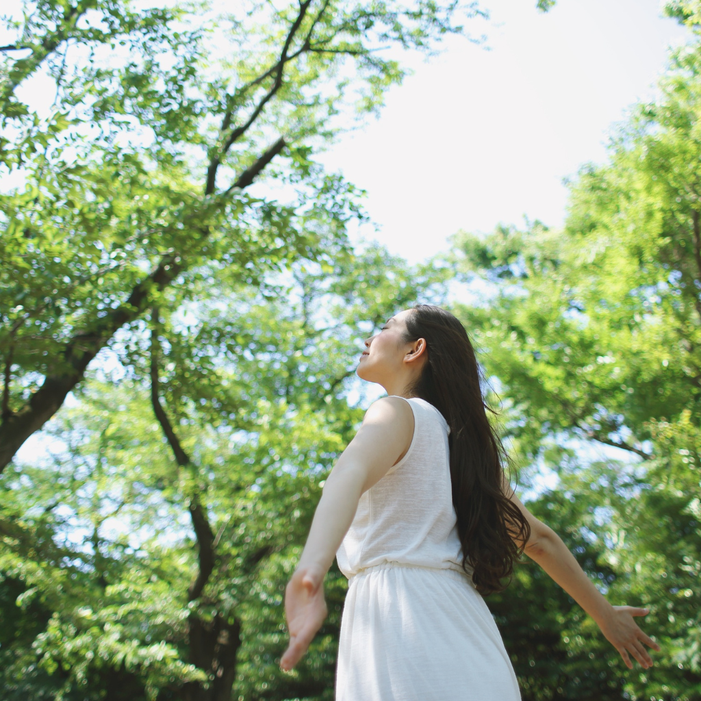 Post-Treatment Phase: Lifestyle Changes That Help Sustain TMS Results 1 Woman enjoying a quiet moment in nature as part of a healthy routine.