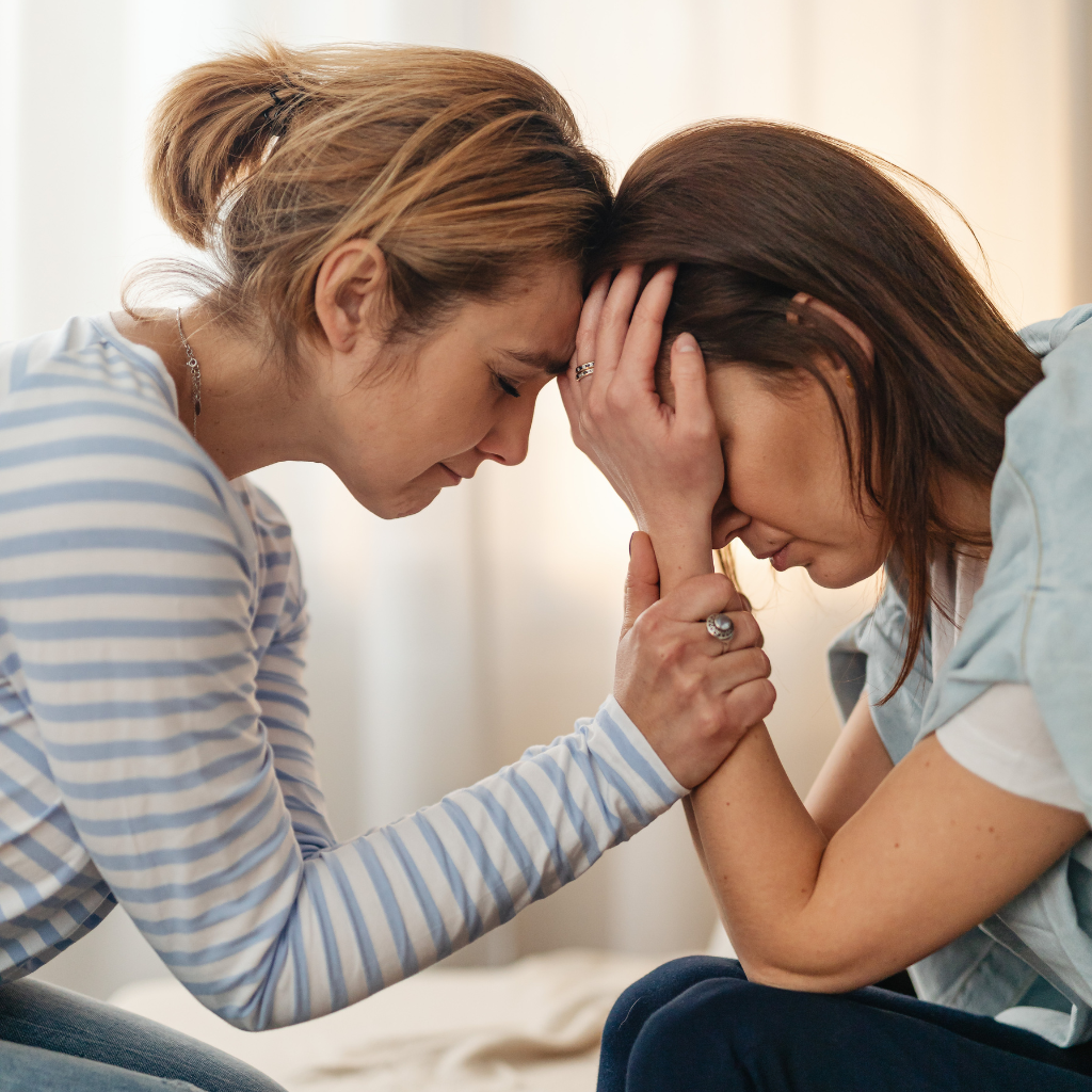 Applications of Transpersonal Psychology in Mental Health Treatment 2 Person comforting a friend who is grieving and struggling emotionally.