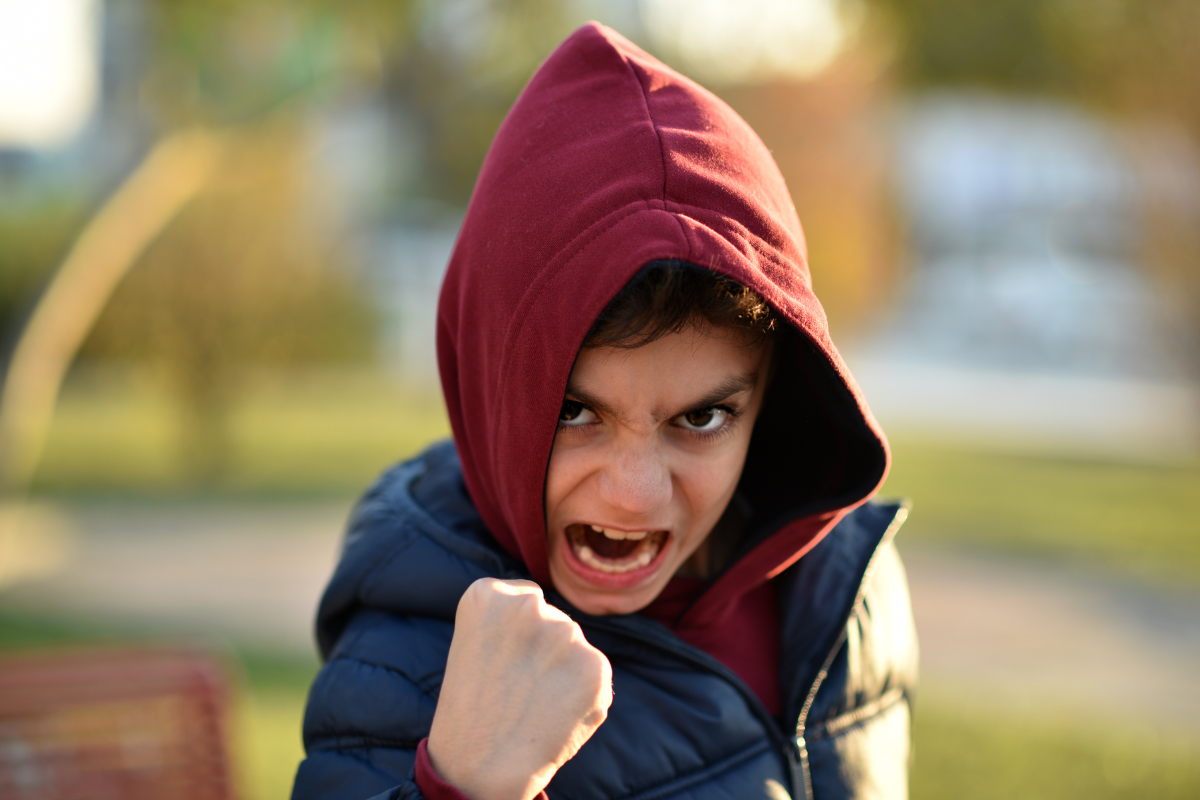 Angry child with a clenched fist