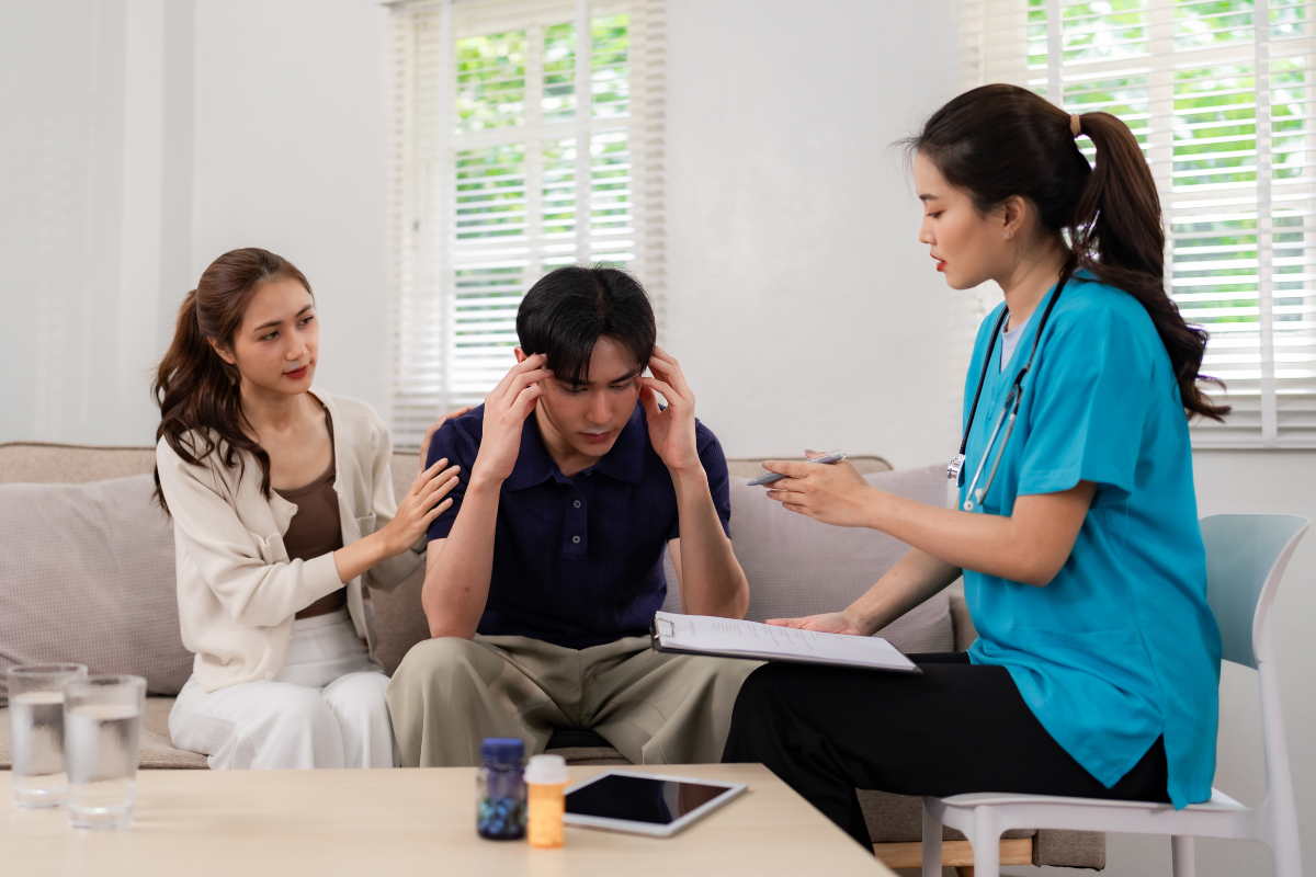 Couple supporting a partner during a mental health consultation for relationship-related stress