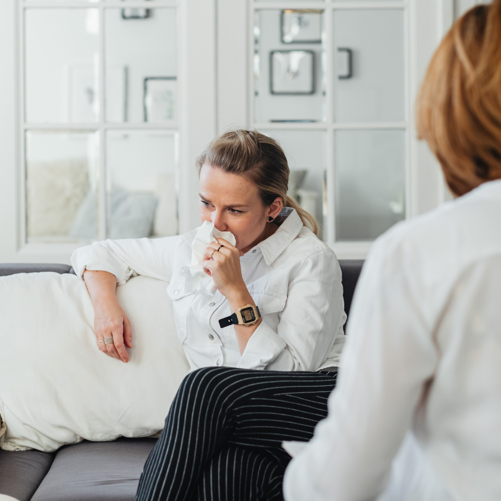 Woman in a therapy session for support with anxiety and ADHD.