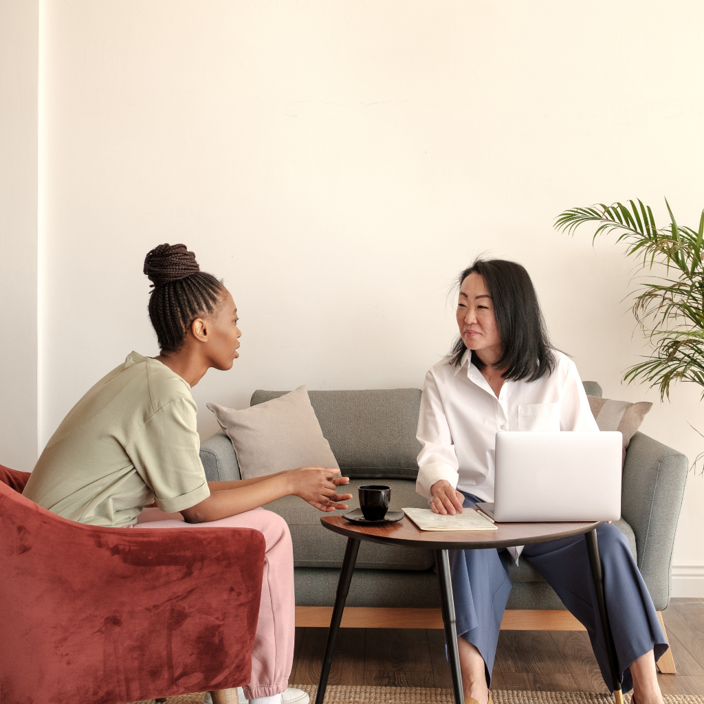 OCD Coping Strategies: Practical Approaches for Everyday Life 2 Person talking with a mental health professional during a therapy session for OCD support and treatment.