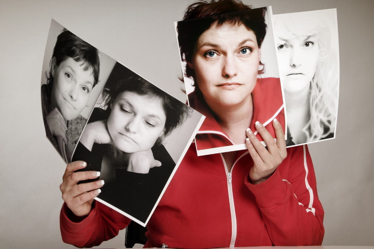 Woman holding images with contrasting emotional expressions, representing rapid cycling bipolar disorder
