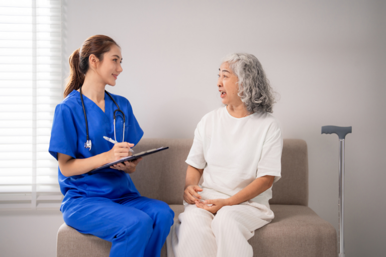 Care manager meeting with an older adult patient during a chronic care management check-in for ongoing mental health support.