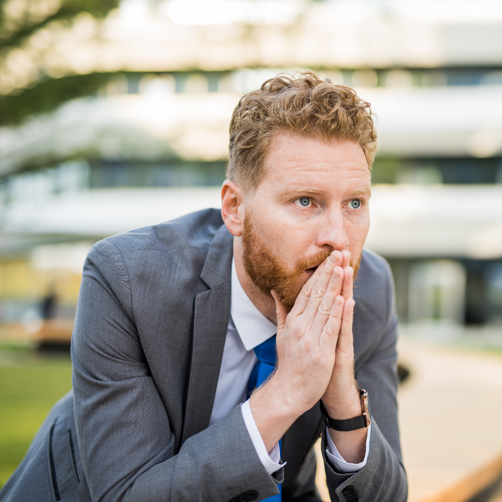 Man appearing tense and worried while anticipating an upcoming event
