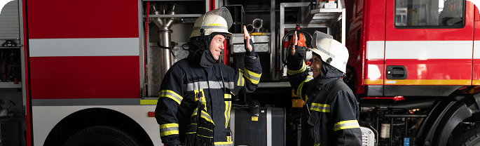 male female firefighters station high fiving after success mission 1 2