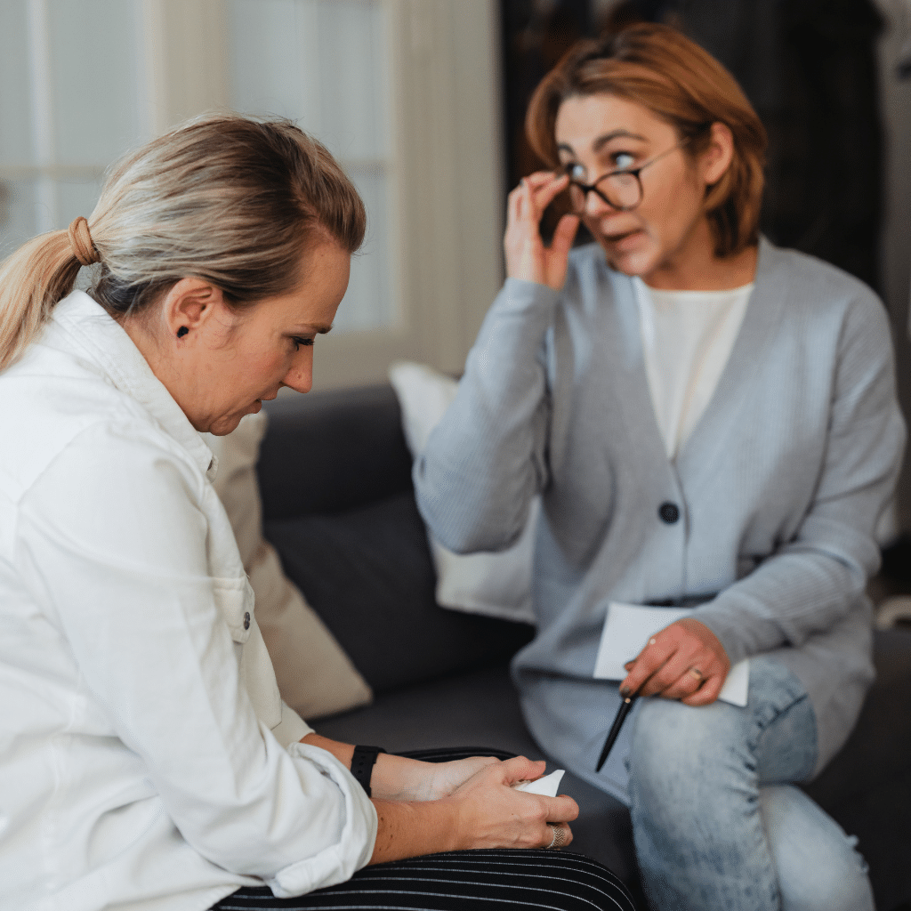 Mental health therapy session illustrating how thoughts, feelings, and behaviors are explored in CBT.