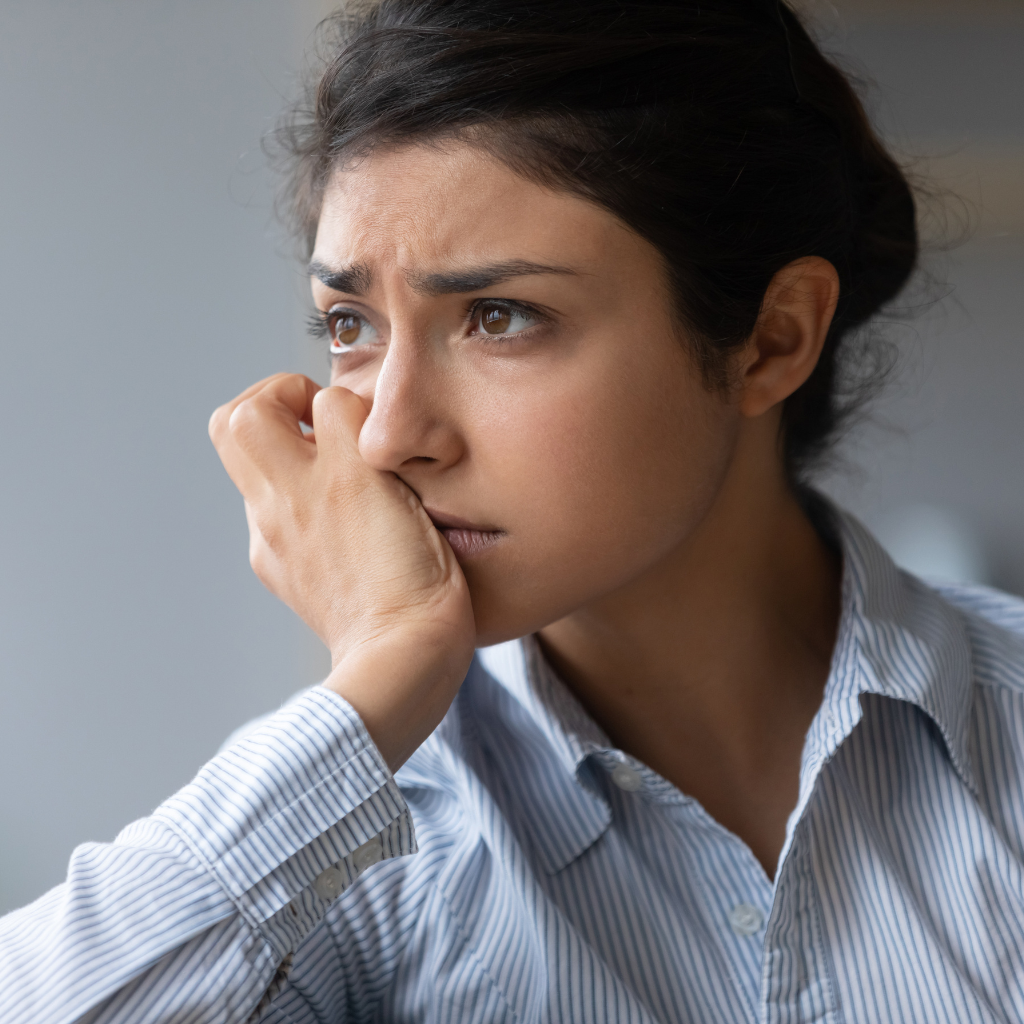 Woman staring blankly and emotionally distressed
