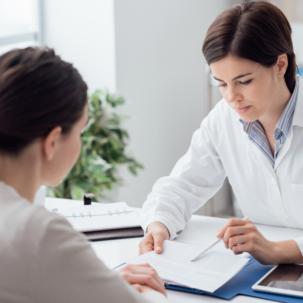 clinician discussing combining medication with TMS therapy as part of a treatment plan