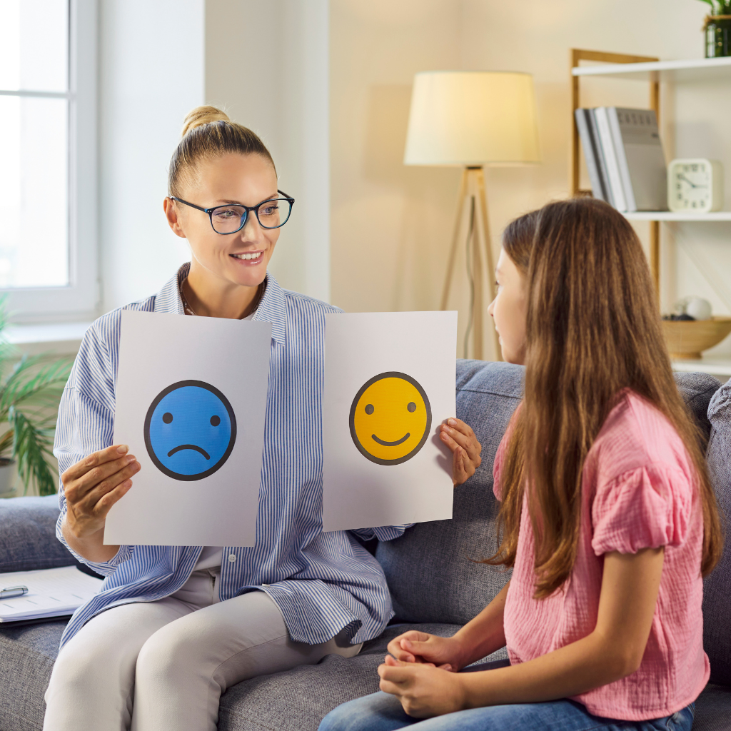 Therapist providing treatment for childhood disorders during a session with a child.