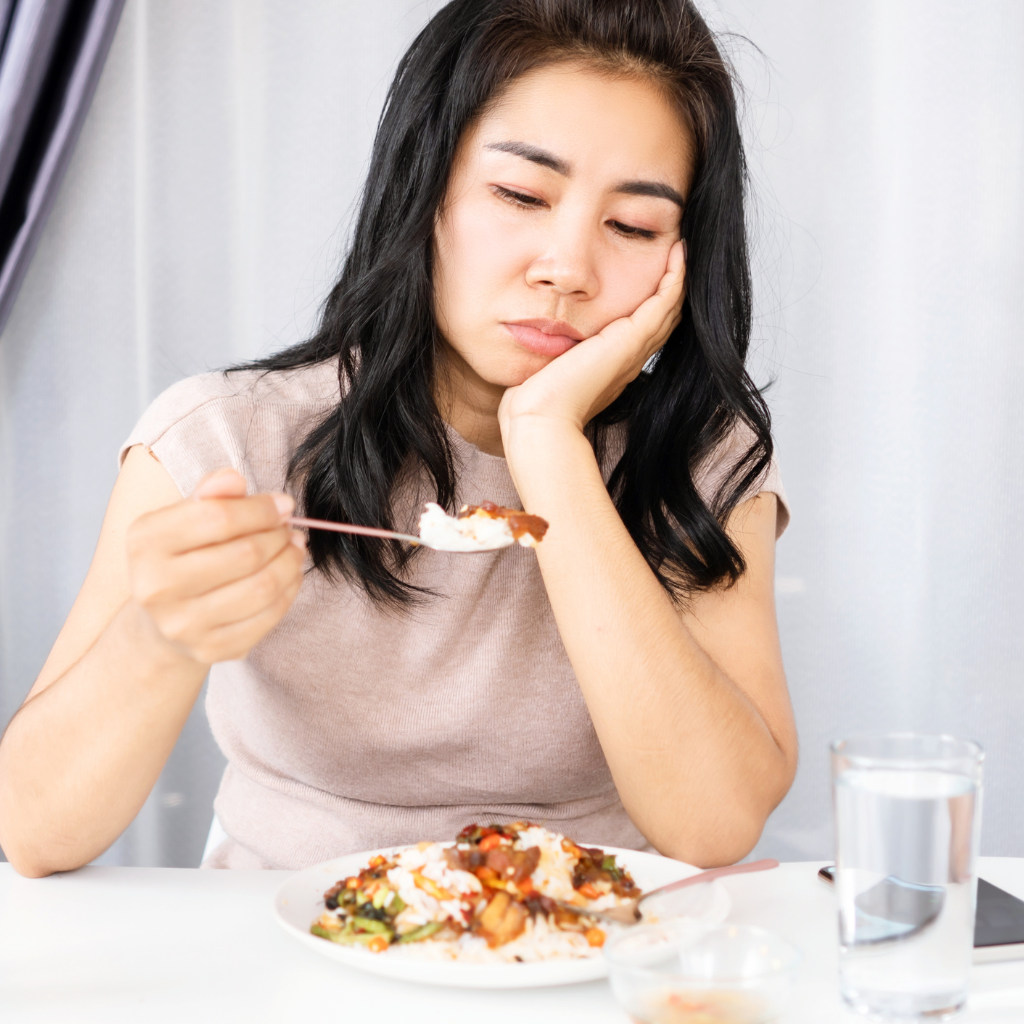 Woman with depression showing little interest in food before TMS treatment.