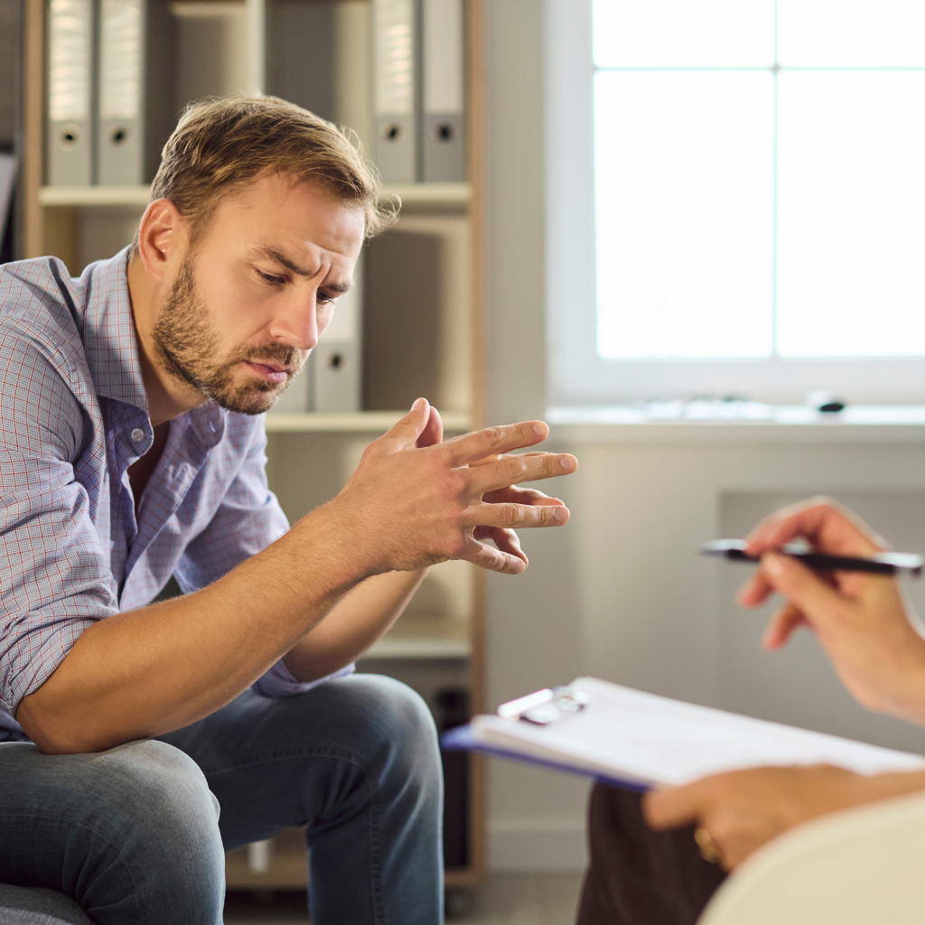 Man discussing high-functioning anxiety with a therapist.