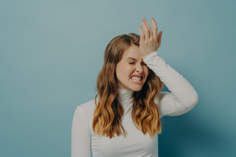 Woman expressing frustration after forgetting something, illustrating ADHD and forgetfulness in daily life.