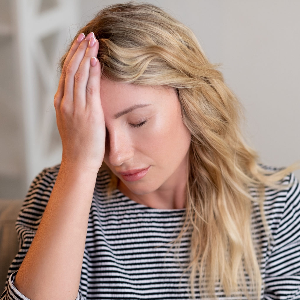 TMS Side Effects: What's Real, What's Rare, and What You Can Stop Worrying About 1 Woman experiencing a headache after TMS treatment.