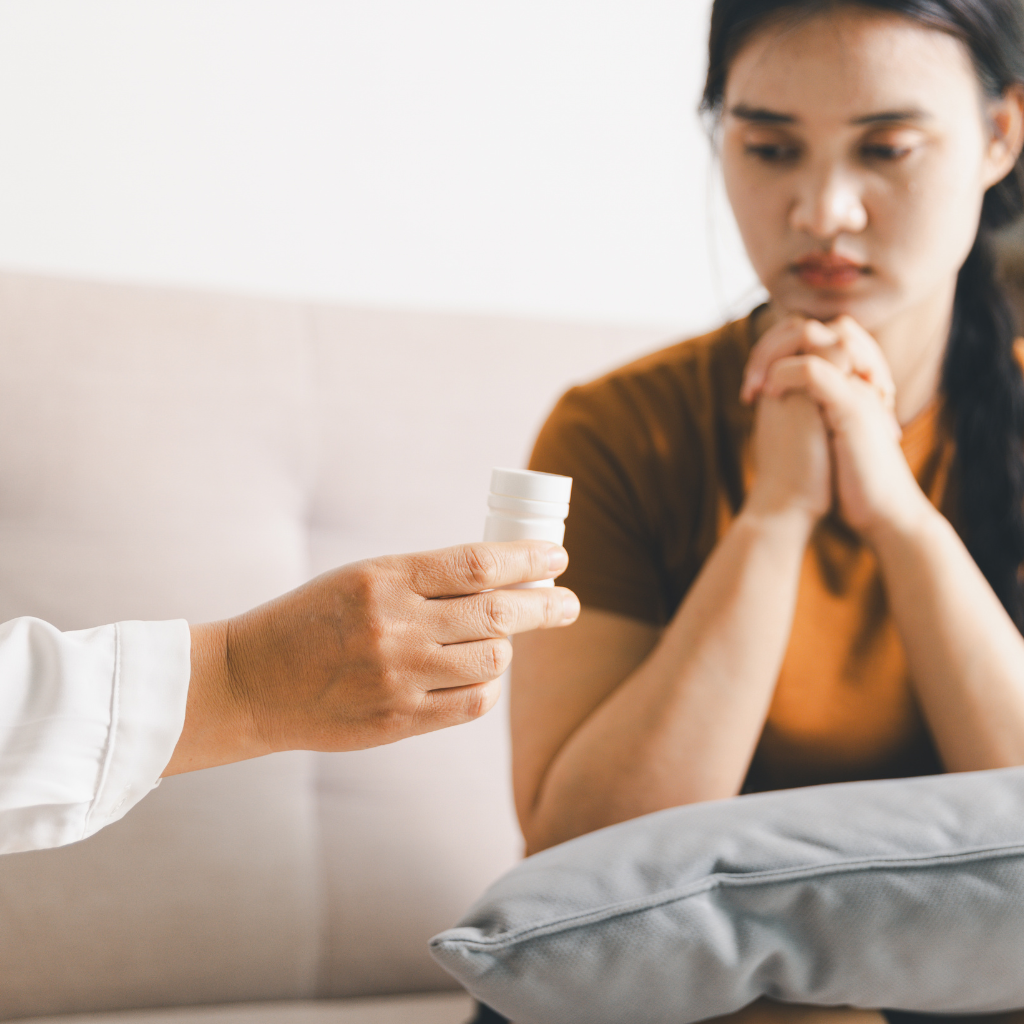 Mental health provider giving patient medication for her anxiety