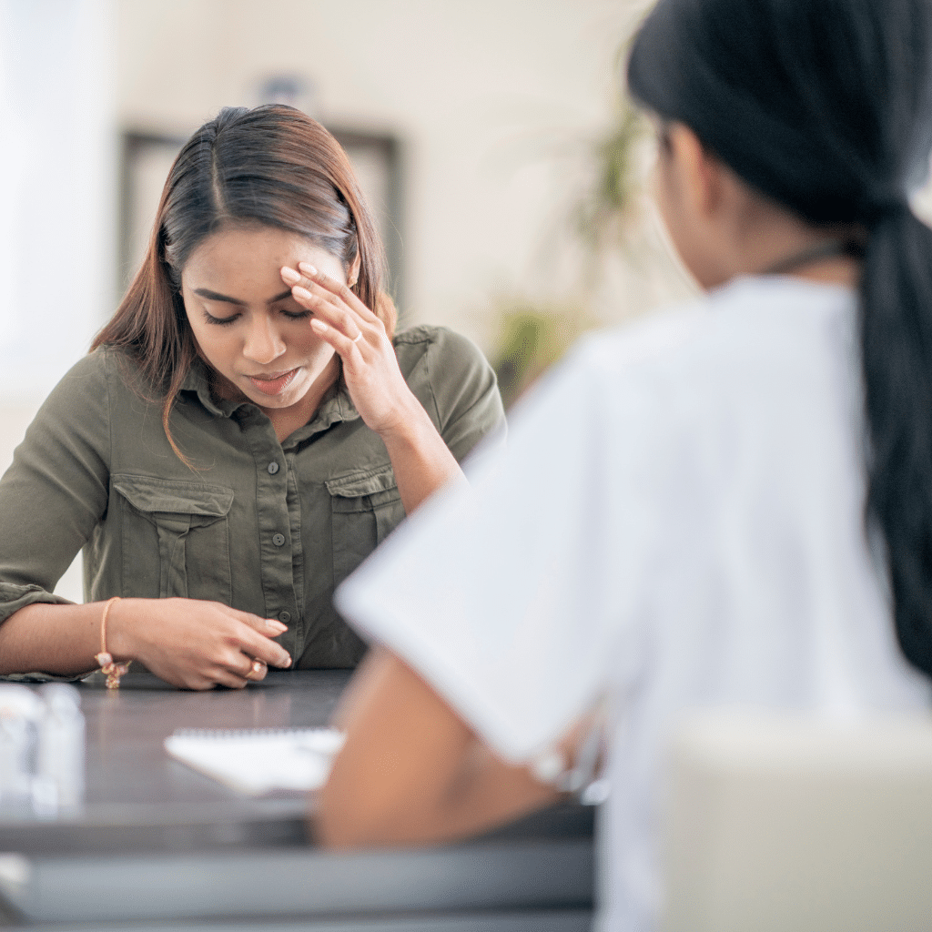 Patient discussing anhedonia symptoms and depression treatment options with a mental health provider.